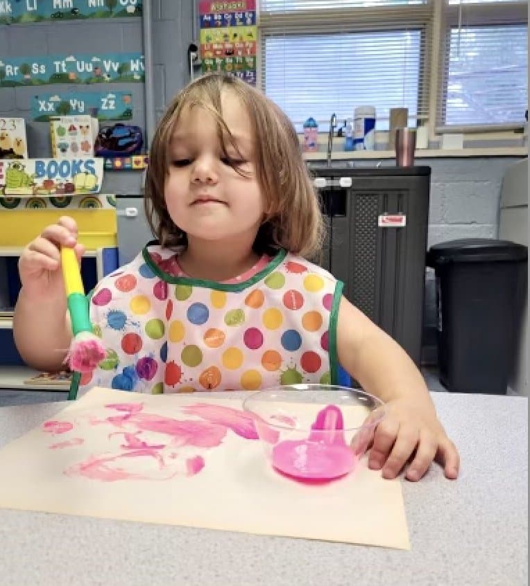 Children exploring hands-on learning at Our HoneyBee Academy
